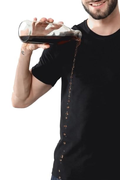 Person pouring dark liquid from a bottle into a shirt against a white background