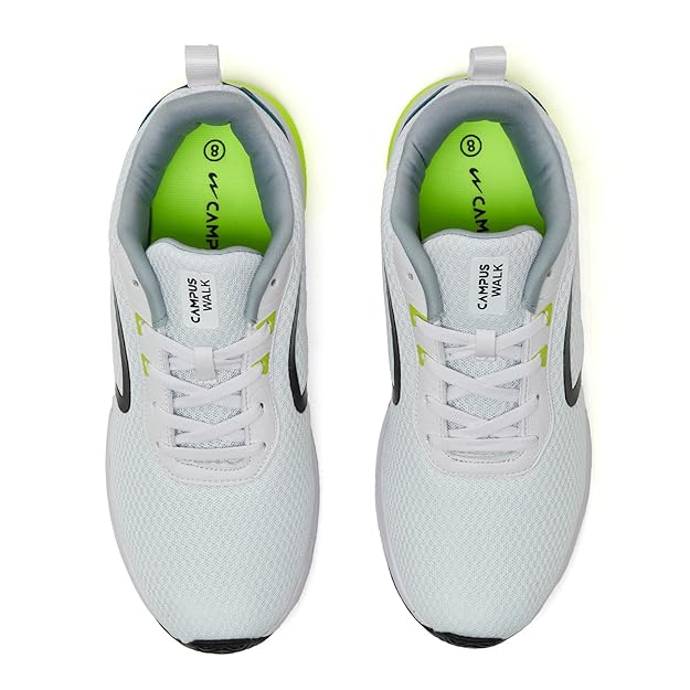 White sneakers with green accents on a white background