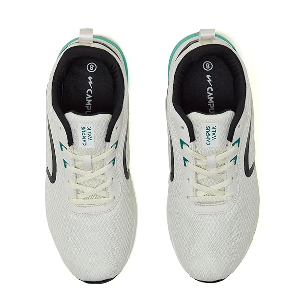 White sneakers with green and black accents on a white background