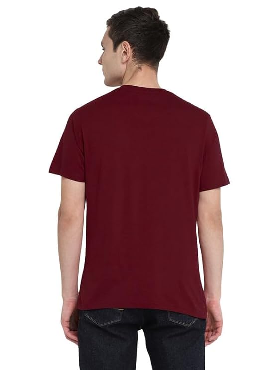 Man wearing a maroon t-shirt on a white background