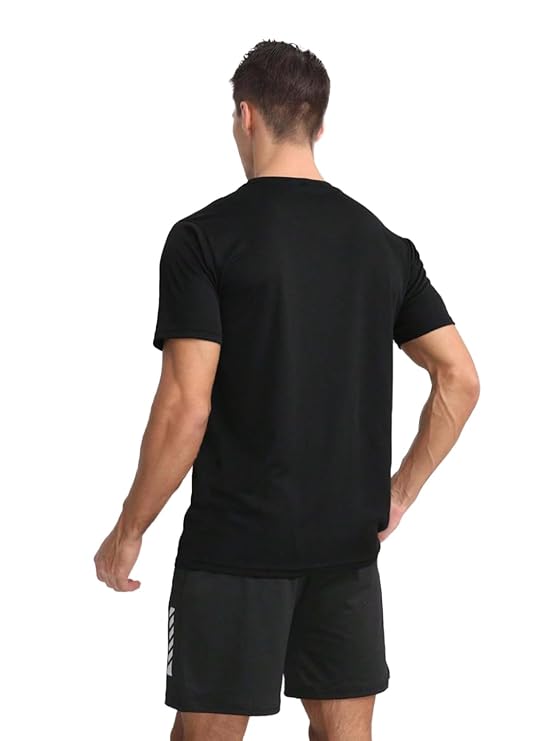Man wearing a black t-shirt and shorts on a white background