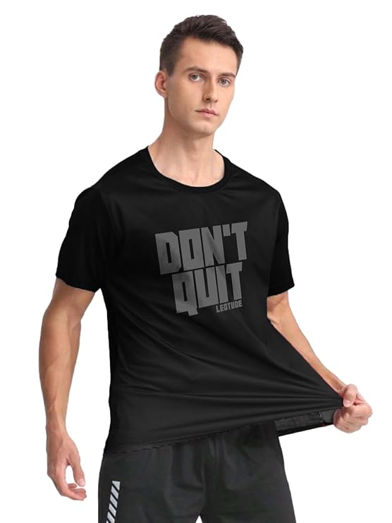 Man wearing a black t-shirt with 'DON'T QUIT' text on a white background